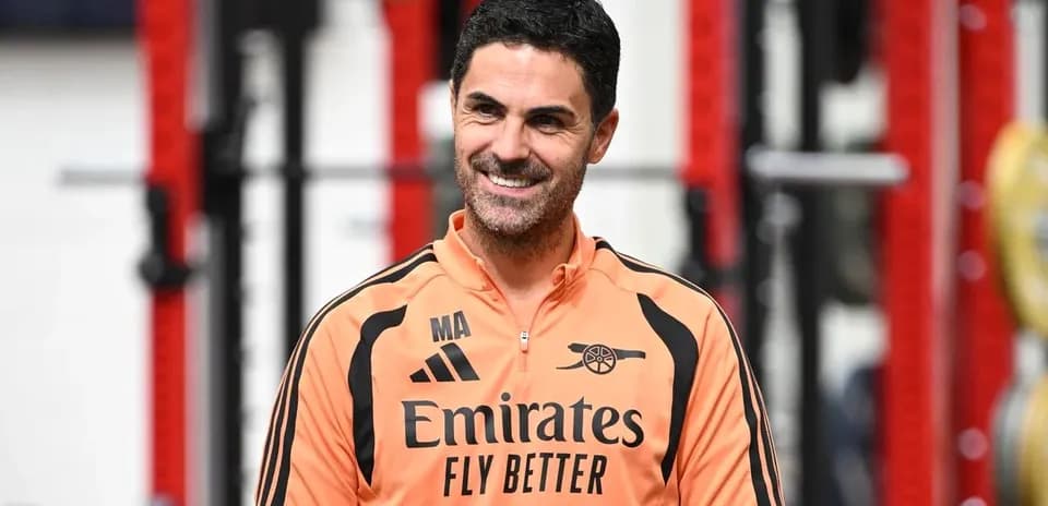Coach smiling during training session at facility