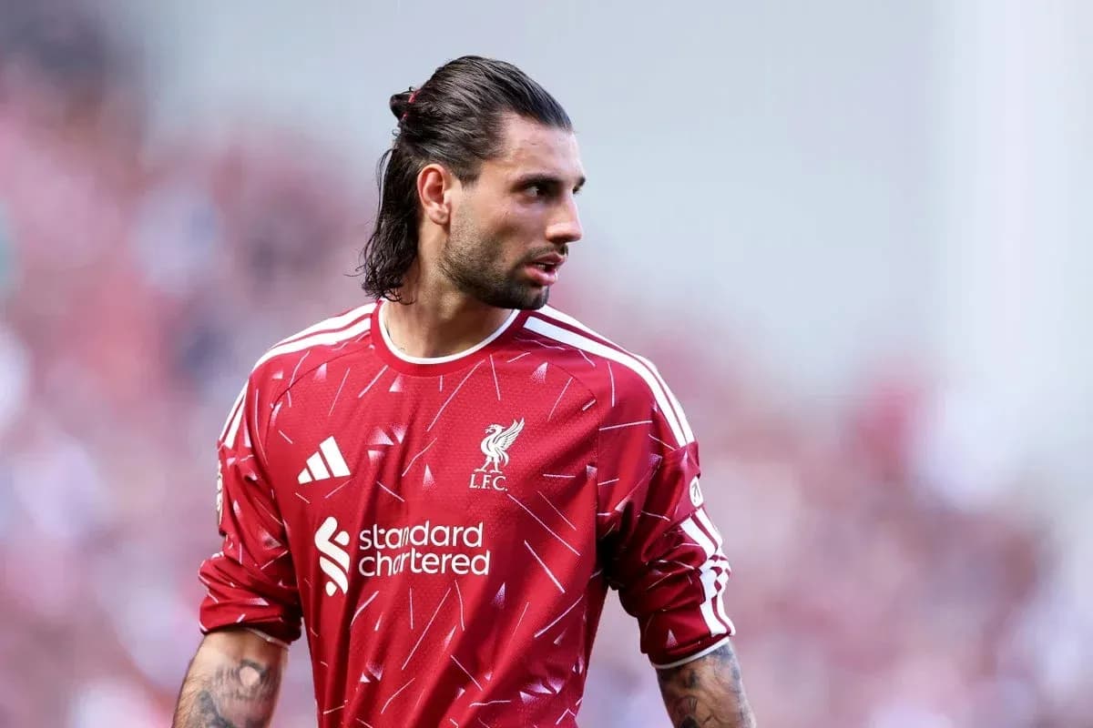 Goalkeeper wearing Liverpool kit on the pitch
