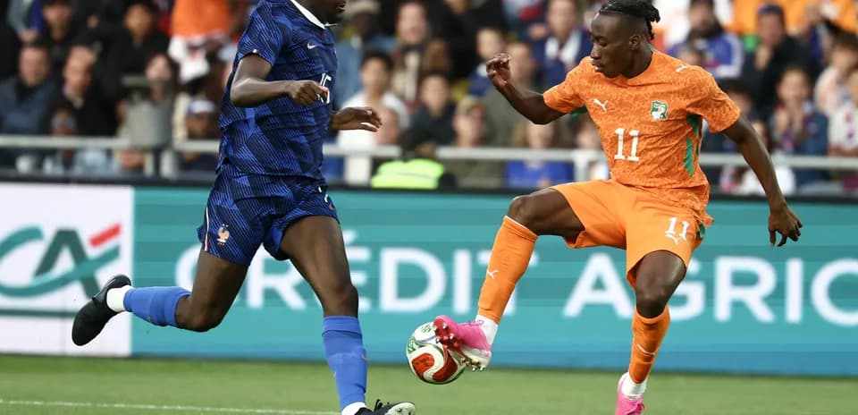 Two players competing for the ball during match