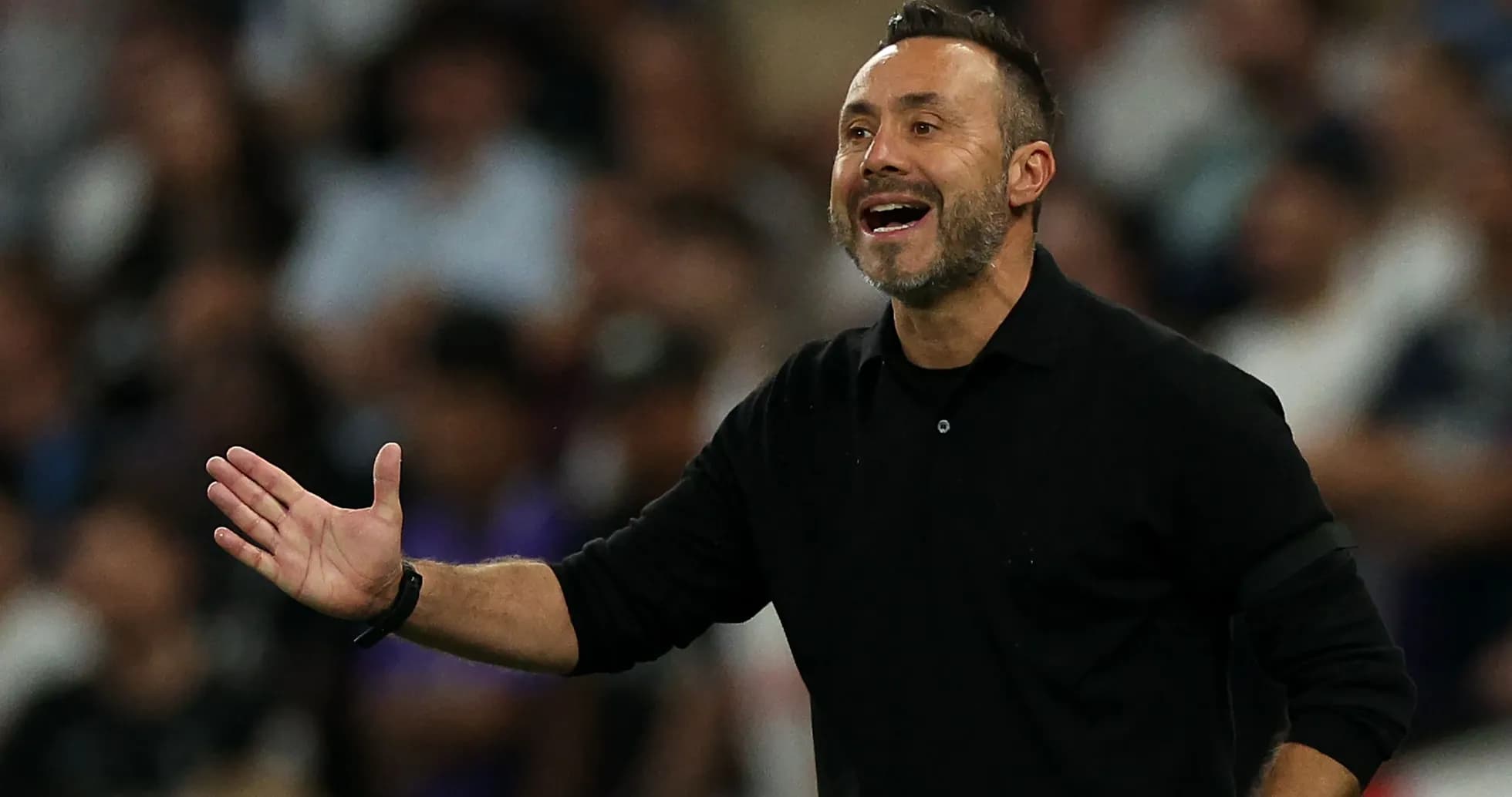 Coach gesturing during a football match