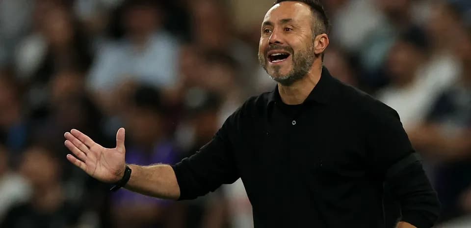 Coach gesturing during a football match