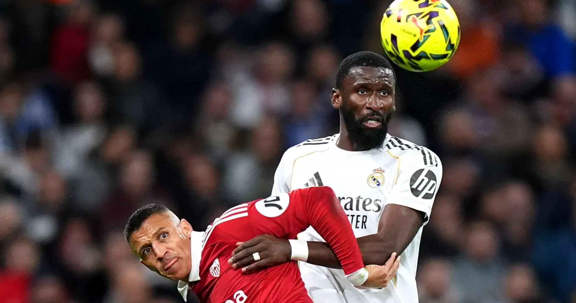 Player challenging for the ball during match