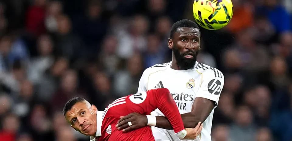 Player challenging for the ball during match