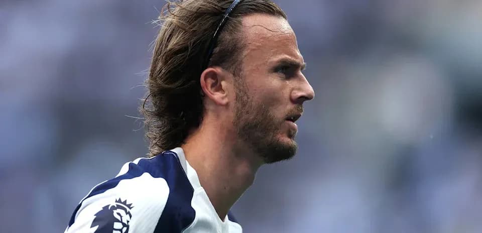 Player in profile wearing Tottenham jersey during match