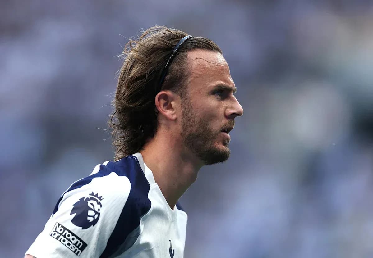 Player in profile wearing Tottenham jersey during match