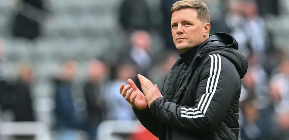 Manager clapping on the sidelines during match