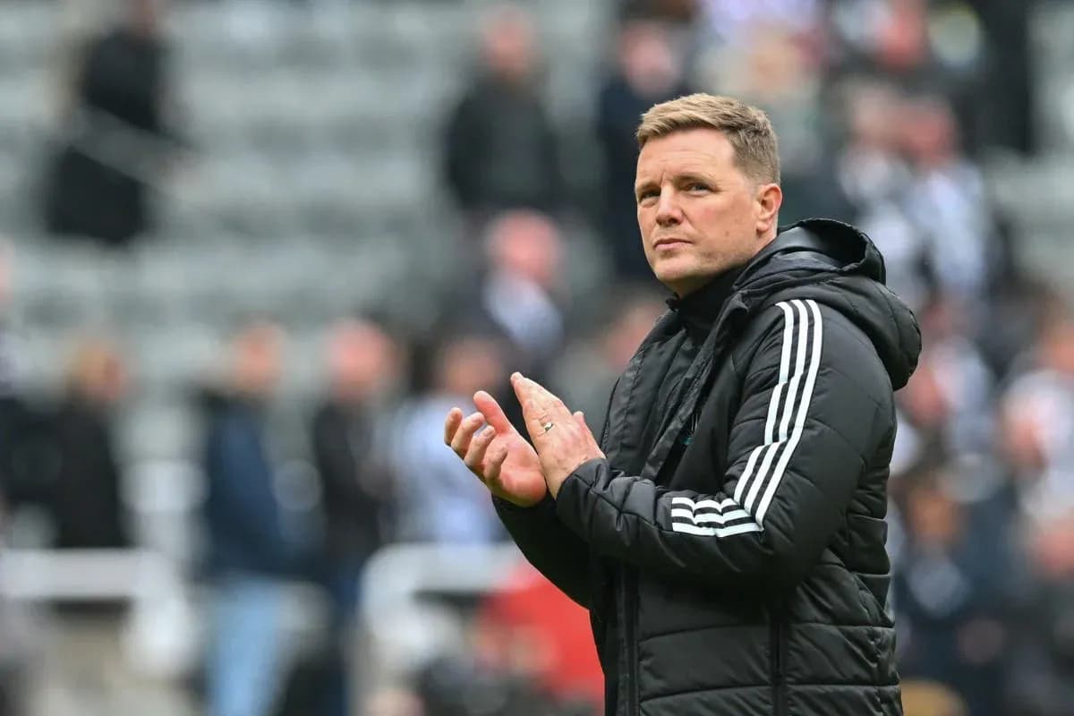 Manager clapping on the sidelines during match