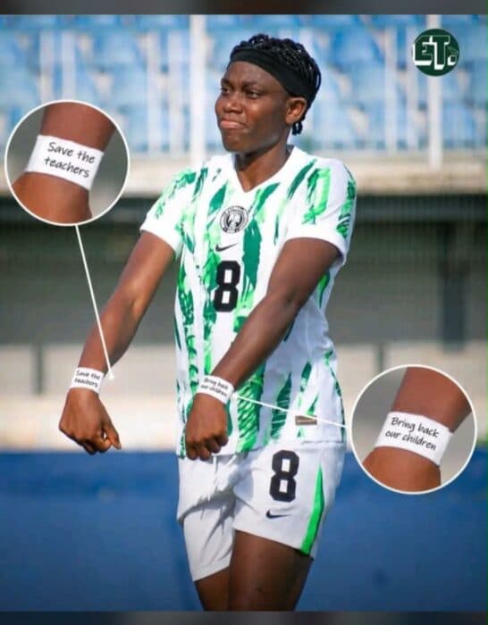 Player wearing Nigeria jersey with protest wristbands