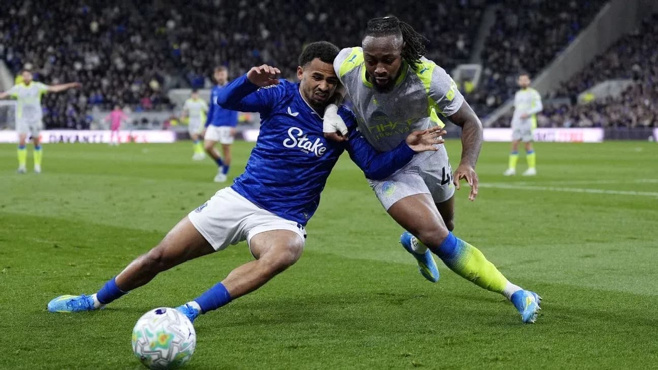 Two players battling for the ball during match