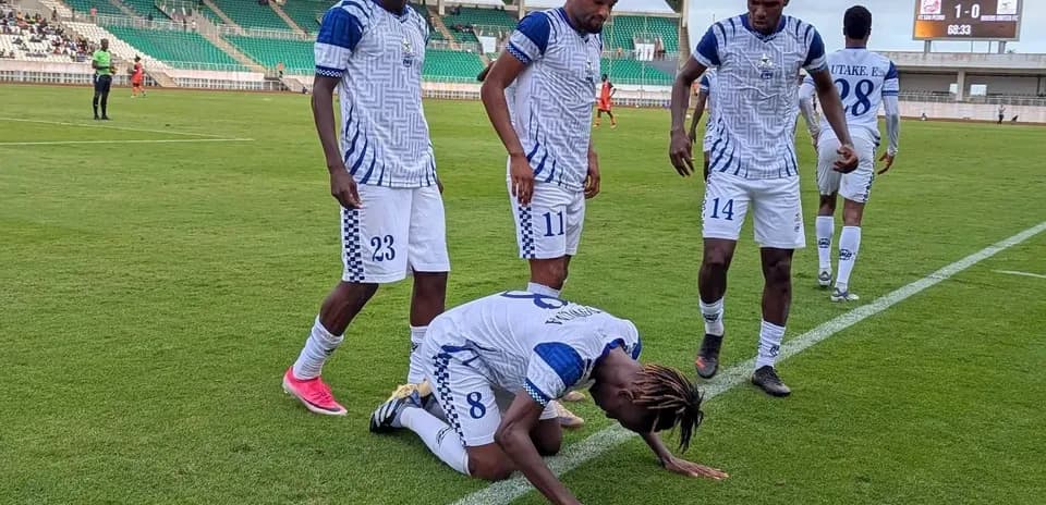 Players celebrating during Rivers United match