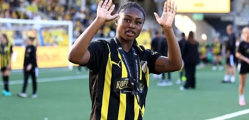 Player waving on the field after a match