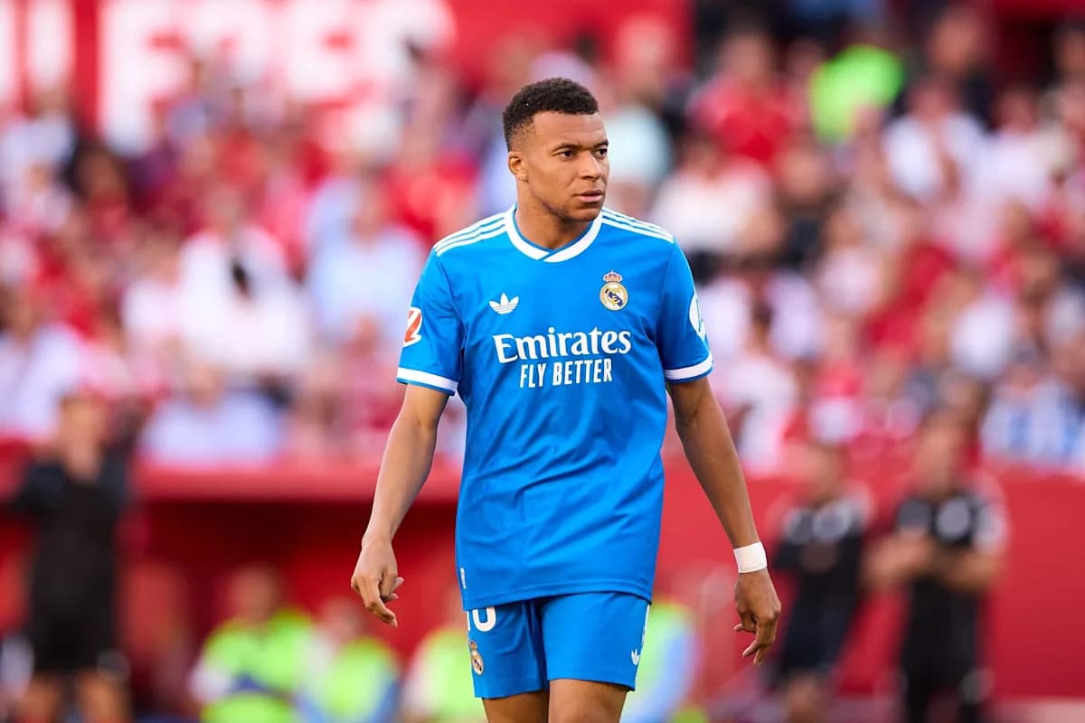 Player in blue jersey walking on the pitch