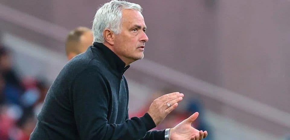 Manager gesturing from the sidelines during match