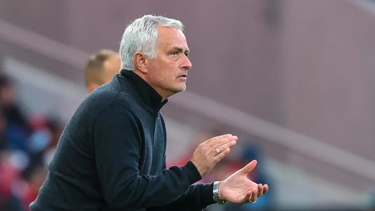 Manager gesturing from the sidelines during match