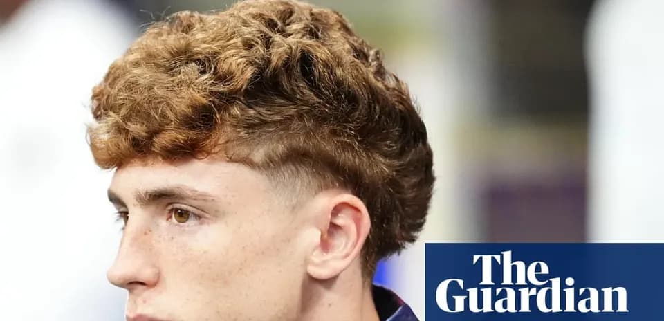 Young man with curly hair looking to the side