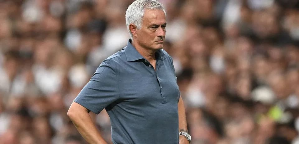Manager observing the game from the sidelines