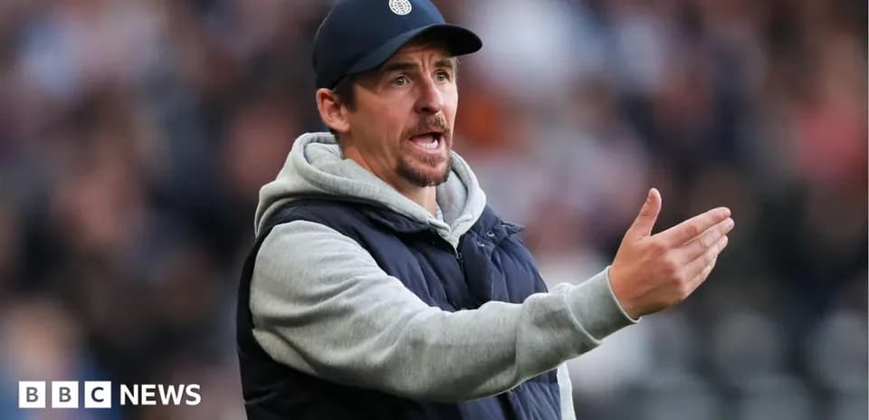 Coach gesturing during a football match