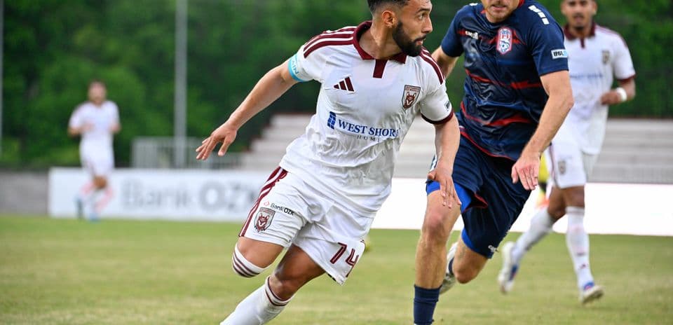 Player dribbling the ball during match action