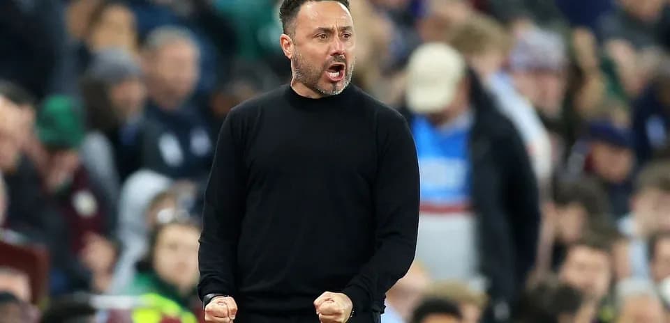 Coach celebrating passionately during a match