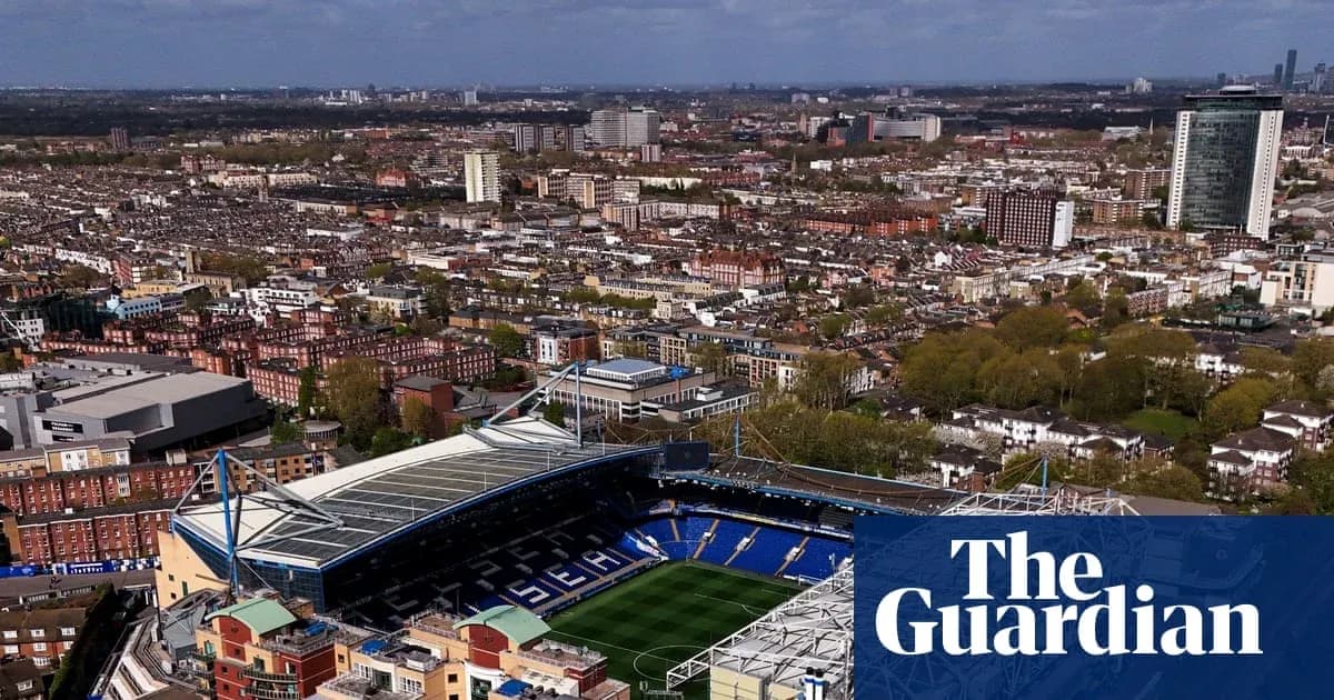 Aerial view of a stadium surrounded by cityscape