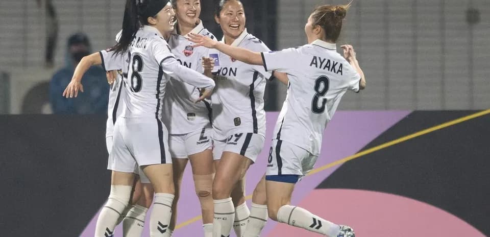 Players celebrating a goal during WK-League match
