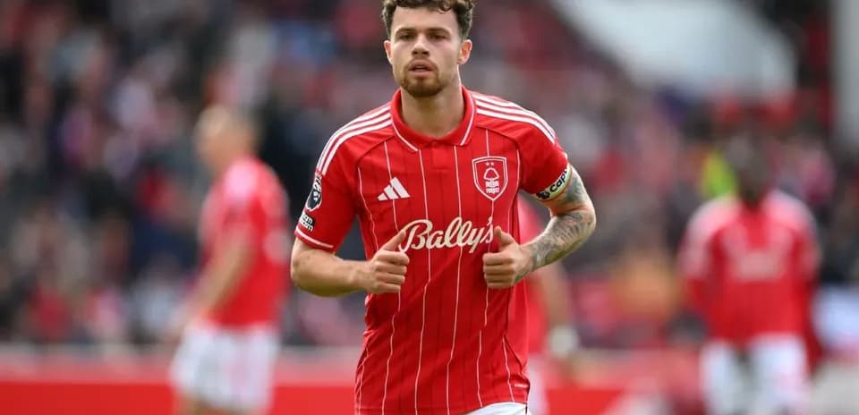 Player in red jersey running during match