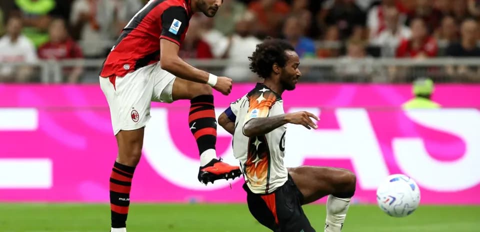 AC Milan player challenges Venezia opponent during match
