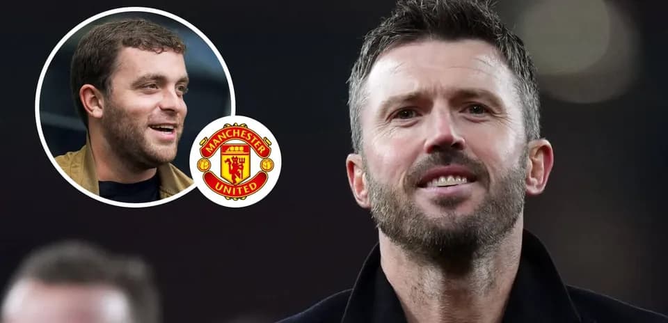 Two men with Manchester United logo in background