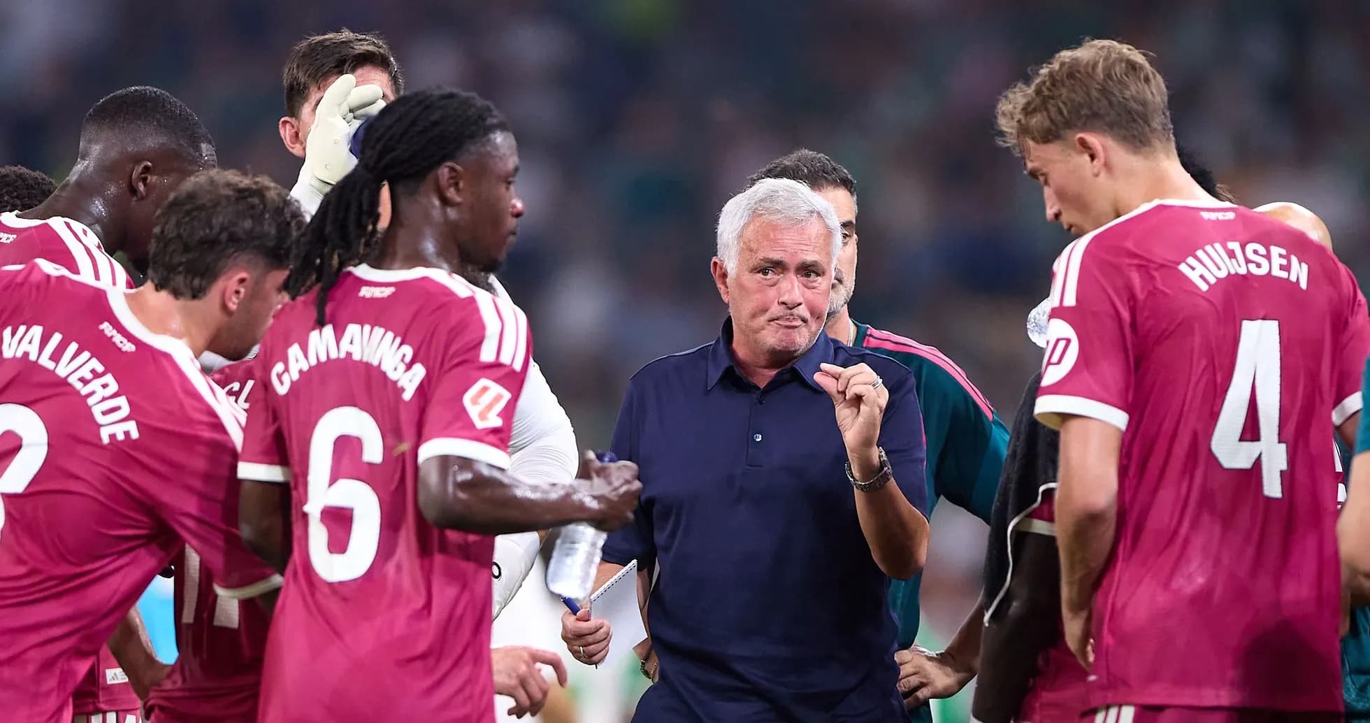 Manager discussing strategy with players during timeout