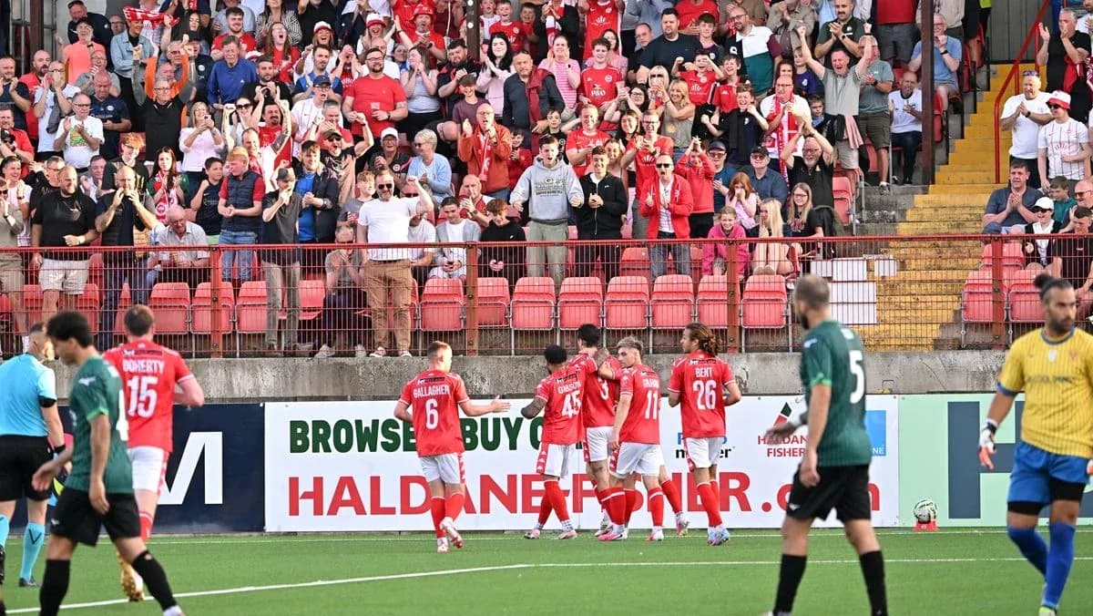 Fans celebrating during Larne football match