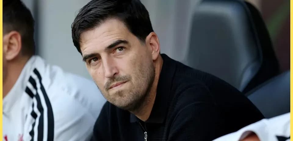 Coach observing from the bench during match