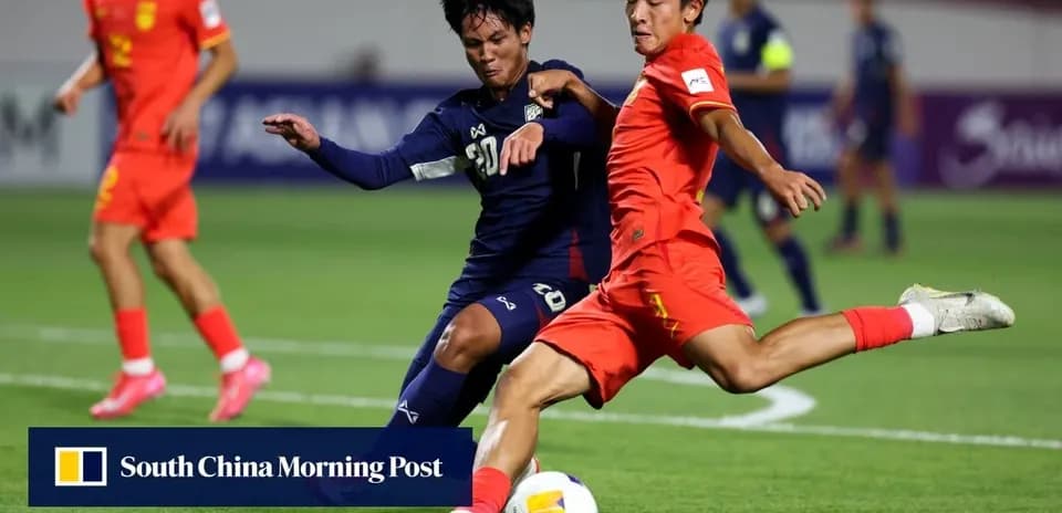 Players tackling during a football match