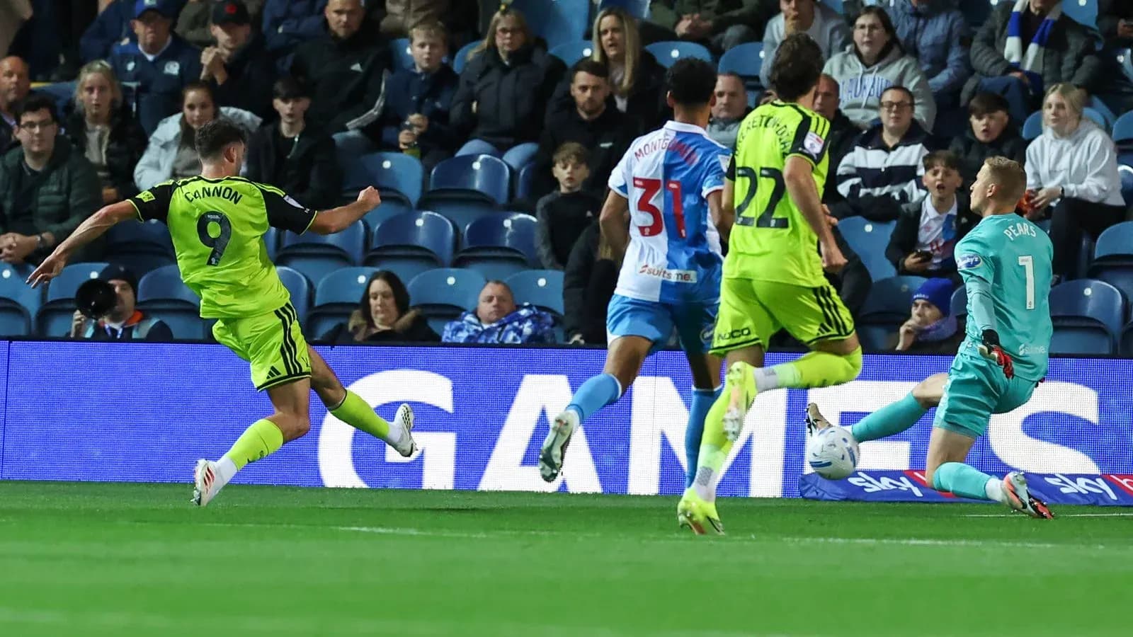 Player shooting on goal during football match