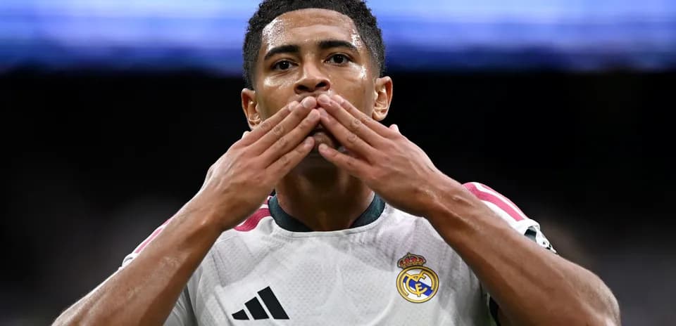 Player celebrating with a kiss gesture after scoring