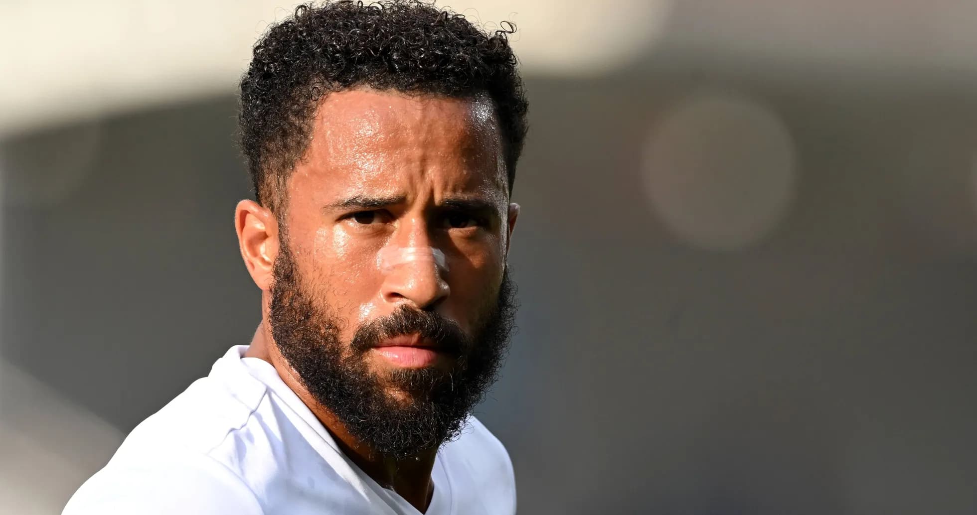 Player with beard and bandage on nose