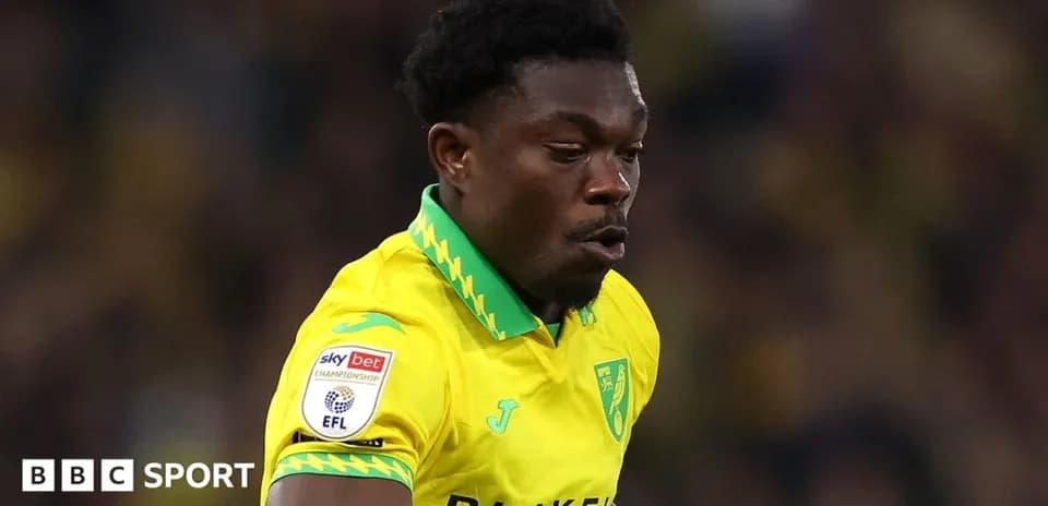 Player in yellow kit during a football match