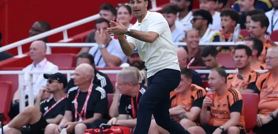 Coach gesturing from the sideline during match