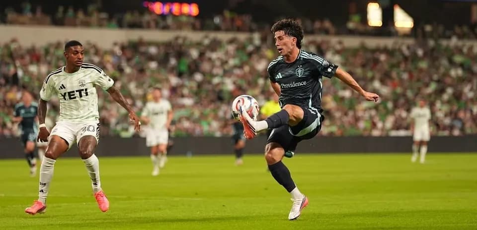 Player kicking the ball during Seattle Sounders match