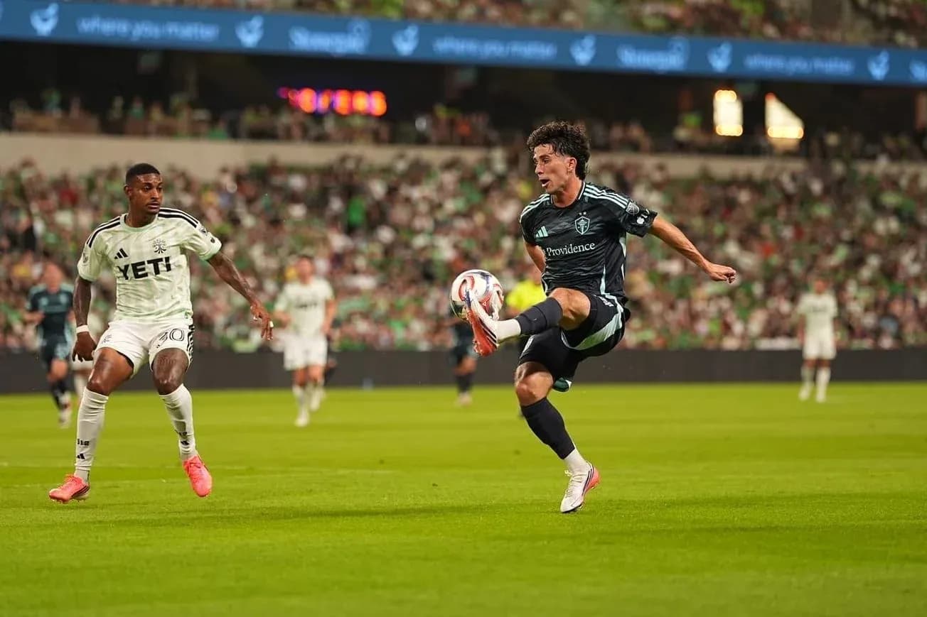 Player kicking the ball during Seattle Sounders match