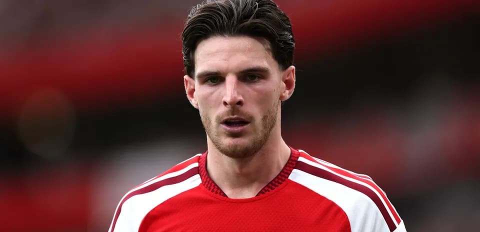 Arsenal player in red jersey on the pitch