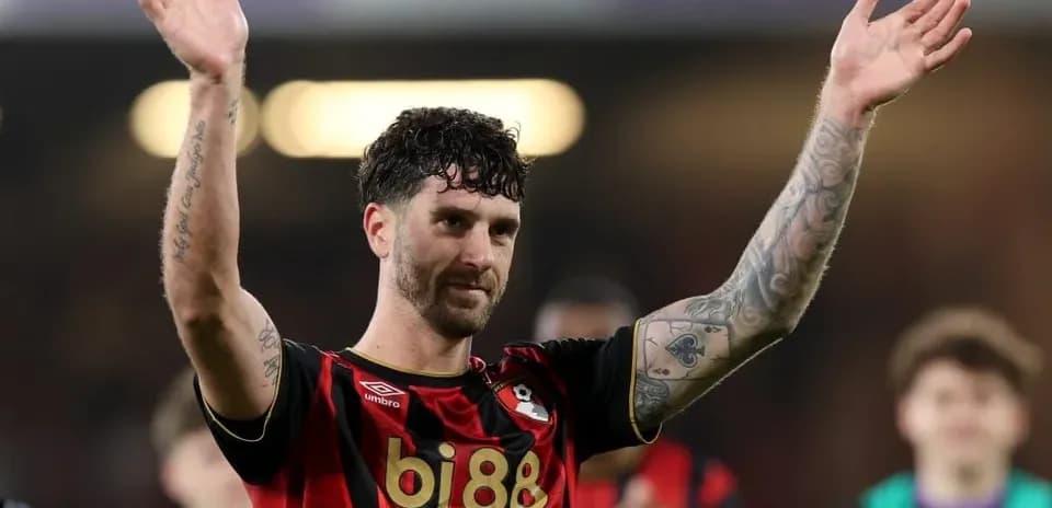 Player celebrating and waving to fans after match
