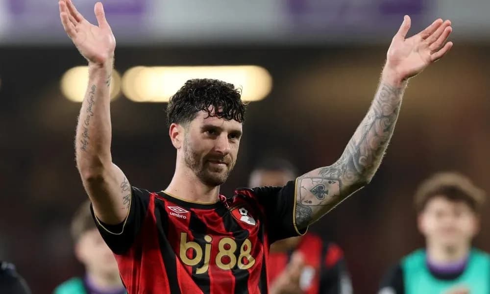 Player celebrating and waving to fans after match