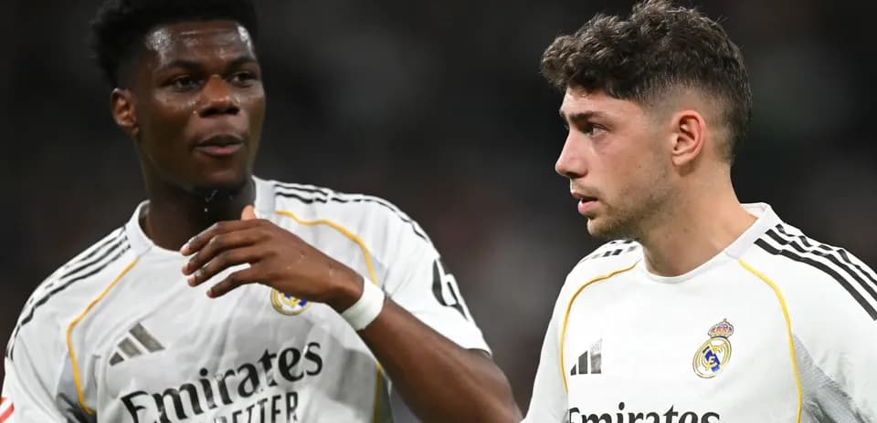 Two Real Madrid players discussing on the pitch