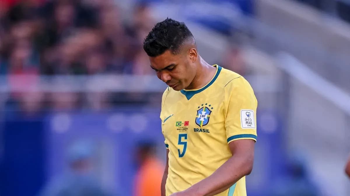 Brazilian player walking with head down during match