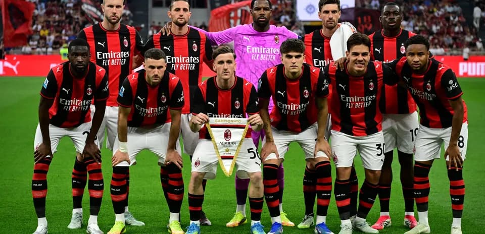 AC Milan team posing with championship banner