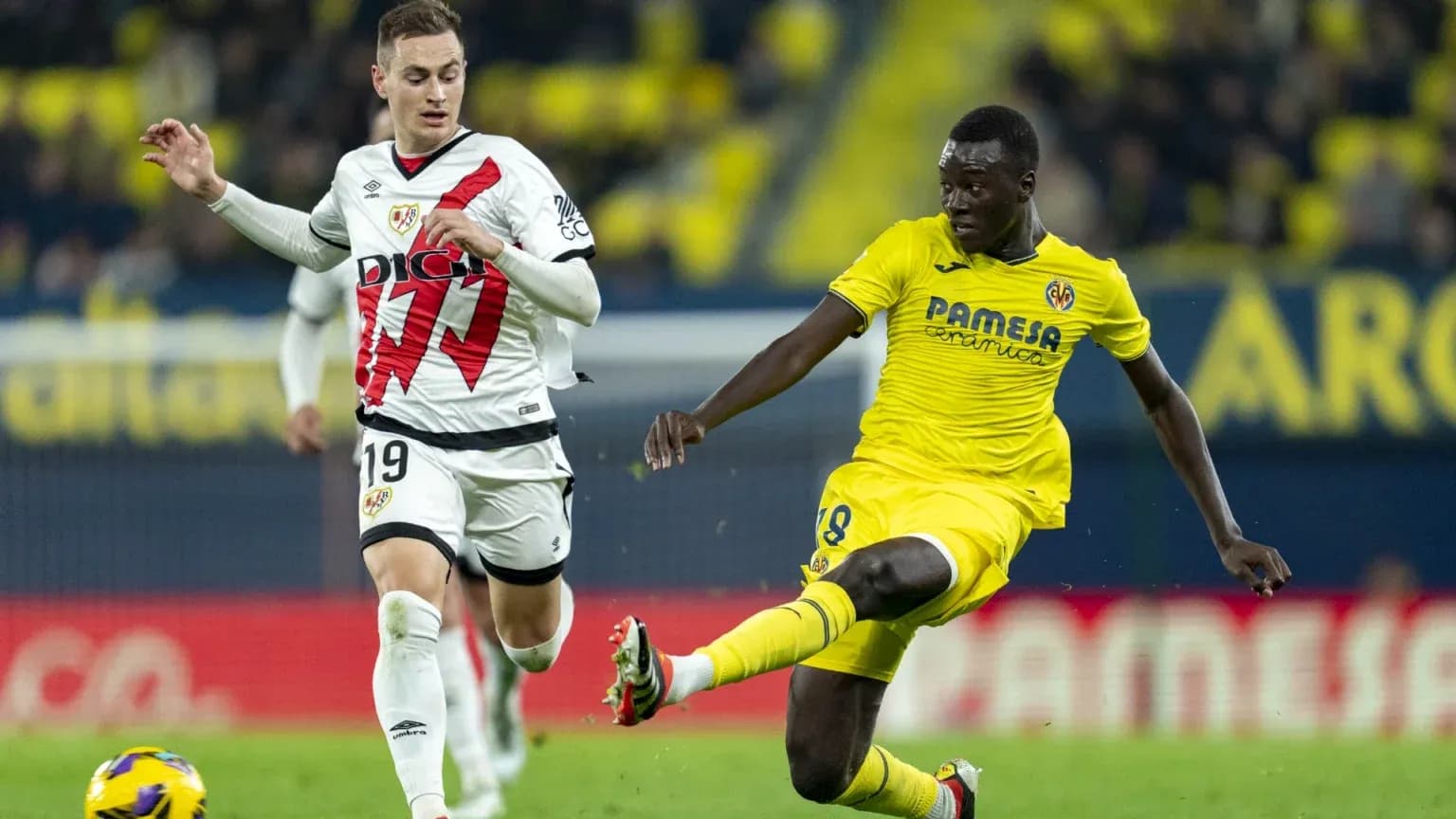Rayo Vallecano and Villarreal players in action