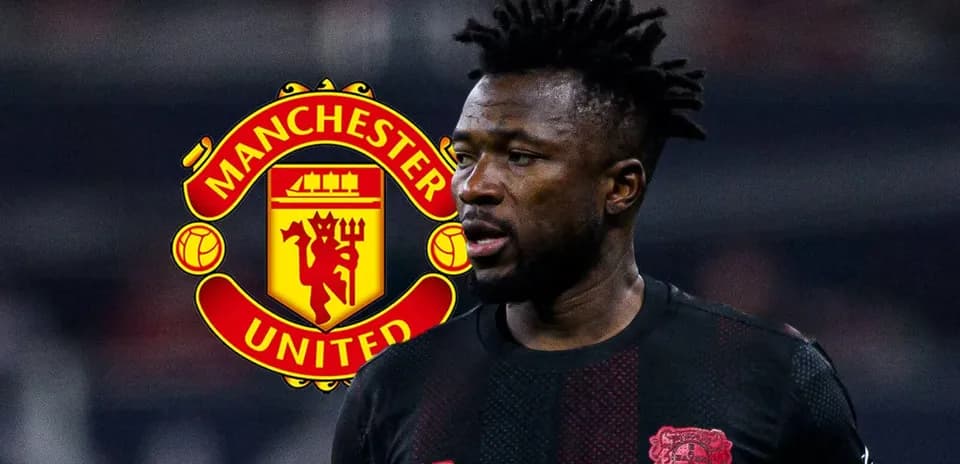 Player in black jersey with Manchester United logo background