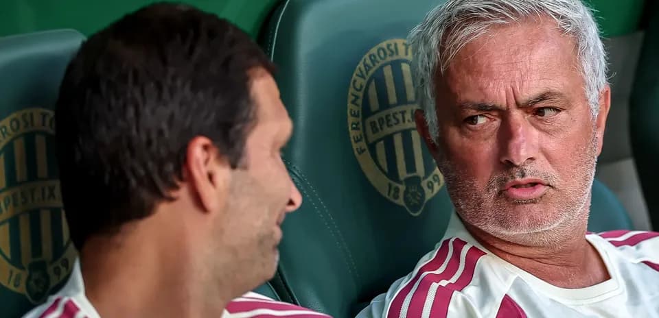 Coaches discussing on the bench during match