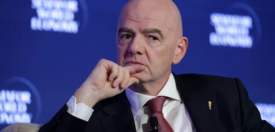 Man in suit speaking at conference event