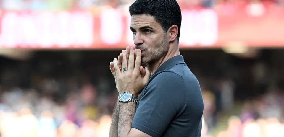 Manager observing the match with hands clasped